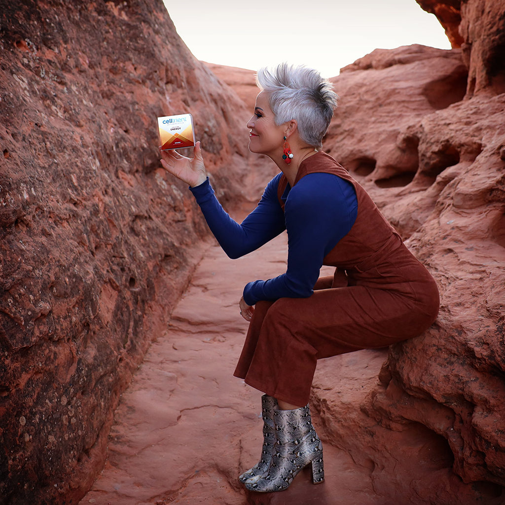 The benefits of using Celltrient Energy. Jumpsuit and snakeskin booties in the red rocks.